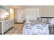 This bedroom features tile flooring, a queen size bed, and a dresser, creating a bright and welcoming space at 935 S Atlantic Ave # 363, Daytona Beach, FL 32118