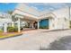 Entrance to Ocean Jewels Club condo features a covered entryway and well-maintained landscaping at 935 S Atlantic Ave # 363, Daytona Beach, FL 32118