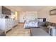 Interior view of condo featuring bed, couch, entry, and TV at 935 S Atlantic Ave # 363, Daytona Beach, FL 32118