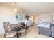 Condo interior featuring dining area, dressers, and bed at 935 S Atlantic Ave # 363, Daytona Beach, FL 32118