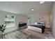 Bright bedroom with king bed, modern decor, and large windows offering ample natural light at 940 Valencia Ave, Daytona Beach, FL 32114