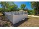 Fenced backyard of a single-story home features well-maintained landscaping and private outdoor space at 940 Valencia Ave, Daytona Beach, FL 32114