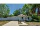 Charming single-story home with light blue exterior, well-manicured lawn, and a long driveway at 940 Valencia Ave, Daytona Beach, FL 32114