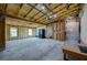Large garage features insulated ceiling and walls, concrete floor, natural light, and an additional storage space at 940 Valencia Ave, Daytona Beach, FL 32114
