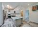 Bright kitchen with stainless steel appliances, light countertops, and wood-look flooring at 940 Valencia Ave, Daytona Beach, FL 32114