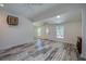 Bright living room featuring vaulted ceilings, sleek flooring, and ample natural light at 940 Valencia Ave, Daytona Beach, FL 32114