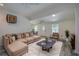 Cozy living room with stylish sectional sofa, modern coffee table, and inviting decor elements at 940 Valencia Ave, Daytona Beach, FL 32114