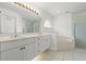 Bright bathroom features double vanity, soaking tub, and glass-enclosed shower at 941 Pizarro Dr, Daytona Beach, FL 32119