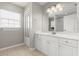 Bathroom with a large vanity, mirror, natural light, and tiled floors at 941 Pizarro Dr, Daytona Beach, FL 32119