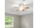 Spacious bedroom with ceiling fan, neutral color, and natural light at 941 Pizarro Dr, Daytona Beach, FL 32119