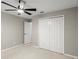 Bedroom featuring a ceiling fan, closet, and neutral walls at 941 Pizarro Dr, Daytona Beach, FL 32119