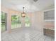 Bright breakfast nook features views, natural light, and pendant lighting at 941 Pizarro Dr, Daytona Beach, FL 32119