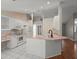 Bright kitchen features a center island, white cabinets, and updated appliances at 941 Pizarro Dr, Daytona Beach, FL 32119