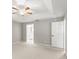 Spacious main bedroom boasts ceiling fan, neutral color and natural light at 941 Pizarro Dr, Daytona Beach, FL 32119