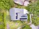 Aerial view of the home with solar panels and well-manicured landscaping at 1018 Heron Point Cir, Deland, FL 32724