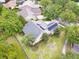 Aerial view showcasing the home's solar panels and lush, green surroundings at 1018 Heron Point Cir, Deland, FL 32724