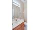 Modest bathroom features vanity sink, toilet, mirror and great lighting at 1018 Heron Point Cir, Deland, FL 32724
