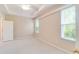 Bright bedroom with tray ceilings and large windows at 1018 Heron Point Cir, Deland, FL 32724