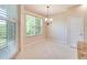 Bright breakfast nook with large window and neutral decor at 1018 Heron Point Cir, Deland, FL 32724