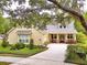 Lovely home with a well-kept lawn, inviting porch, and ample parking on the concrete driveway at 1018 Heron Point Cir, Deland, FL 32724