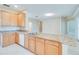 Bright kitchen with stainless appliances and a granite countertop island at 1018 Heron Point Cir, Deland, FL 32724