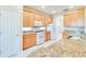 Bright kitchen features granite countertops, stainless appliances, and lots of storage at 1018 Heron Point Cir, Deland, FL 32724