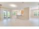 Open-concept living room with lots of natural light and access to the back patio at 1018 Heron Point Cir, Deland, FL 32724