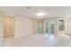 Well-lit living room features French doors and neutral decor at 1018 Heron Point Cir, Deland, FL 32724