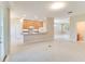 Open living room features a kitchen with bar seating, lots of light, and open floorplan at 1018 Heron Point Cir, Deland, FL 32724