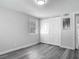 Bedroom featuring modern gray plank flooring, a closet, and a window at 102 Judges Ln, Port Orange, FL 32129