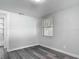 Bedroom featuring modern gray plank flooring and a bright window at 102 Judges Ln, Port Orange, FL 32129