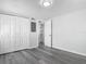 Bedroom with modern gray plank flooring, a closet, and a doorway to another room at 102 Judges Ln, Port Orange, FL 32129