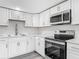 Kitchen featuring stainless steel appliances, grey countertops, and overhead microwave at 102 Judges Ln, Port Orange, FL 32129