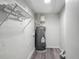 Utility room with grey flooring and a newer model water heater at 102 Judges Ln, Port Orange, FL 32129