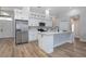 Modern kitchen with white cabinets, stainless steel appliances, and a center island at 104 Balmoral Ct, Debary, FL 32713