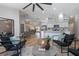 Open living area featuring wood-look floors, modern decor, and seamless flow to dining and kitchen at 104 Balmoral Ct, Debary, FL 32713