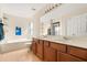 Spacious bathroom with a double vanity, soaking tub, and a separate shower at 109 Fern Springs St, Debary, FL 32713