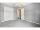Gray bedroom with carpet, closet, and neutral trim at 109 Fern Springs St, Debary, FL 32713