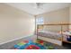 Bright bedroom features natural light, a ceiling fan, and carpet at 109 Fern Springs St, Debary, FL 32713