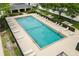 The community pool is surrounded by lounge chairs and greenery at 109 Fern Springs St, Debary, FL 32713