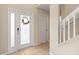 Inviting entryway with tile flooring and a decorative glass front door and sidelight at 109 Fern Springs St, Debary, FL 32713