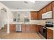 Well-lit kitchen showcasing stainless steel appliances and abundant countertop space at 109 Fern Springs St, Debary, FL 32713