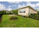 Landscaped backyard with blooming flowers, brick patio and sprinkler system at 1118 Avery Meadows Way, Deland, FL 32724