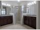 Bathroom featuring double sink vanity and glass-enclosed shower at 1118 Avery Meadows Way, Deland, FL 32724