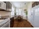 Sunlit breakfast nook featuring wood floors, plantation shutters, and stylish pendant lighting at 1118 Avery Meadows Way, Deland, FL 32724