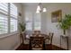 Cozy dining area filled with natural light from a bright window with custom window coverings at 1118 Avery Meadows Way, Deland, FL 32724