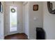 Bright entryway featuring a glass panel front door and wood-look floors at 1118 Avery Meadows Way, Deland, FL 32724