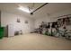 Spacious garage with epoxy flooring, storage racks, and bike at 1118 Avery Meadows Way, Deland, FL 32724