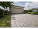 The house has a two car garage and a brick paved driveway at 1118 Avery Meadows Way, Deland, FL 32724