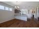 Open kitchen with granite countertops, a breakfast bar, and wood-look floors at 1118 Avery Meadows Way, Deland, FL 32724